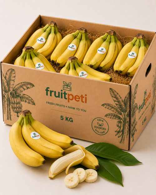 A 5 kg cardboard box of FruitPeti bananas, shown open with multiple bunches of yellow bananas inside. Additional loose bananas, a peeled banana, sliced bananas, and green leaves are arranged in front of the box on a clean white background.