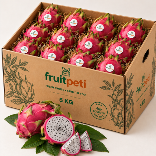 A 5 kg cardboard box filled with bright pink dragon fruit, with two whole dragon fruits and sliced pieces with green leaves placed in front on a clean white background. The box is branded fruitpeti.