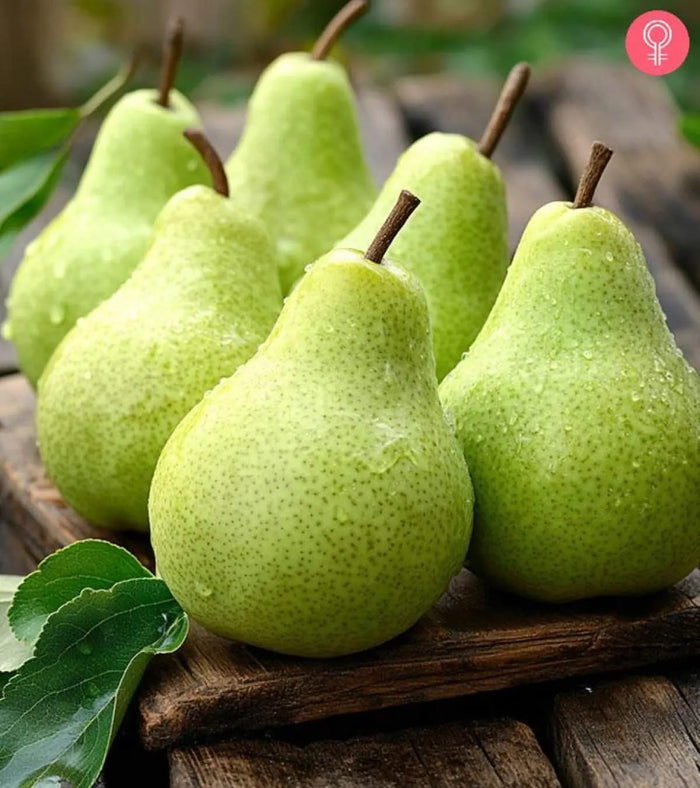 Fresh green pears with water drops outdoor